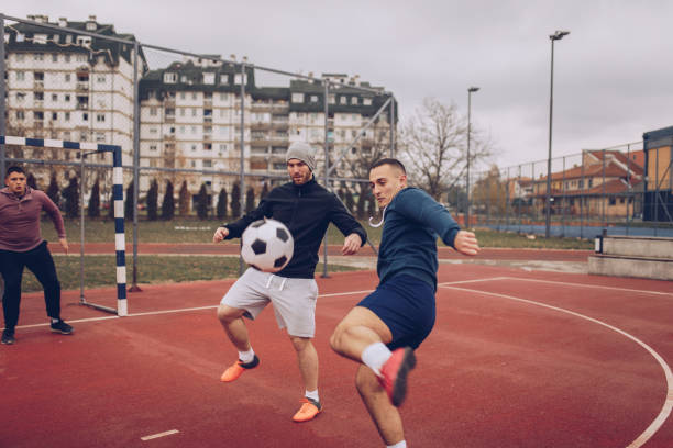 istock Boys playing soccer outdoors 930122200