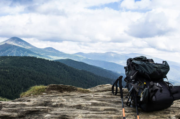 istock Tourist backpack in the background of mountains. Traveling with a backpack. 930122448