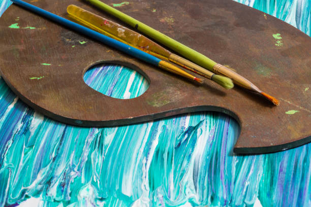 Painter palette to mix colors with brushes and colours. Oils and mix media