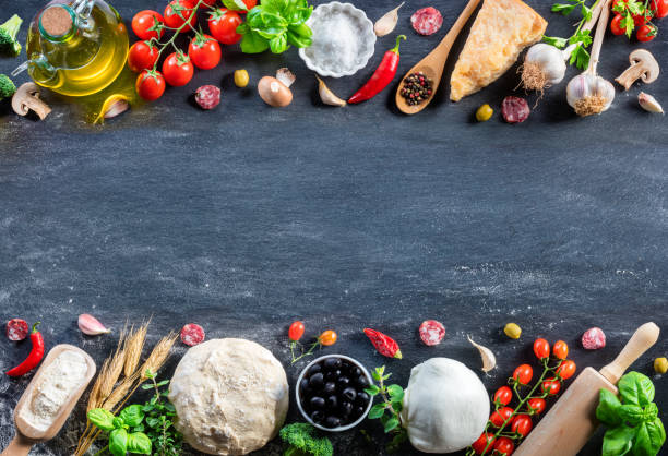 istock Pizza Ingredients On Black Table In A Raw - Italian Food 930129942