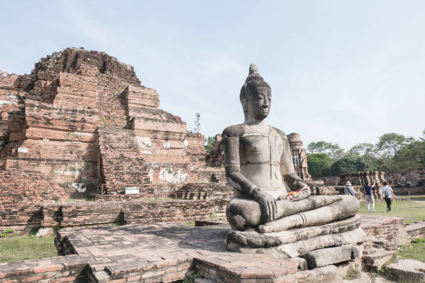 istock Old buddha statue and ancient building at Wat Worachet Tharam temple at Ayutthaya historical park in Ayutthaya, Thailand. 930130828