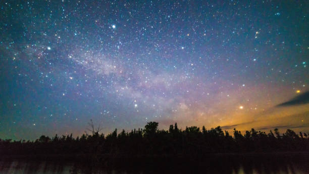 istock Milky way and stars over the trees at night time 930140738