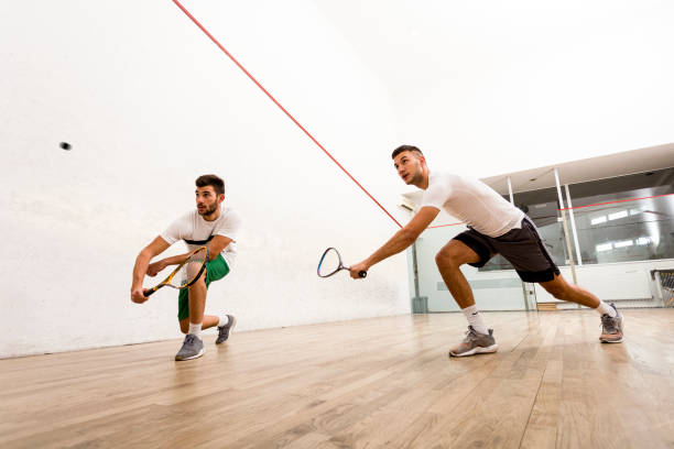 Men playing squash on court Men playing squash squash sport stock pictures, royalty-free photos & images