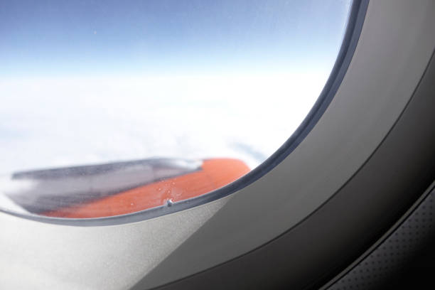 istock Window of the plane with view of the sky wing and engine 930143910