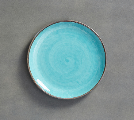 Sky Blue Swirl Melamine Plate with dark gray background