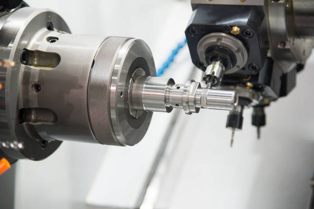 istock The  CNC lathe machine milling the steel shaft 930148202