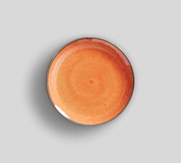 istock Orange Swirl Melamine Plate with light gray background 930148298