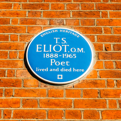 London, UK - March 8, 2018: English Heritage blue plague of where the famous poet T.S Eliot lived and died, 1888-1965 in a flat in Kensington, London, England, UK