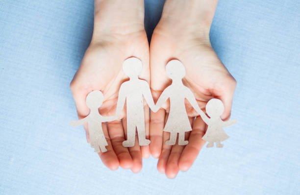 istock Paper family on a palm 930154540