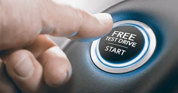 Man pushing a free test drive button. Composite image between a finger photography and a 3D background.