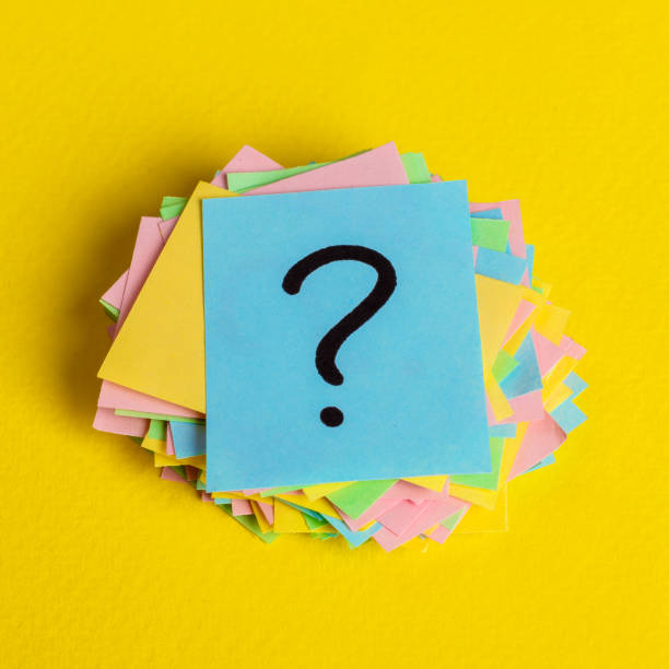 istock Just a lot of question marks on colored papers 930155124