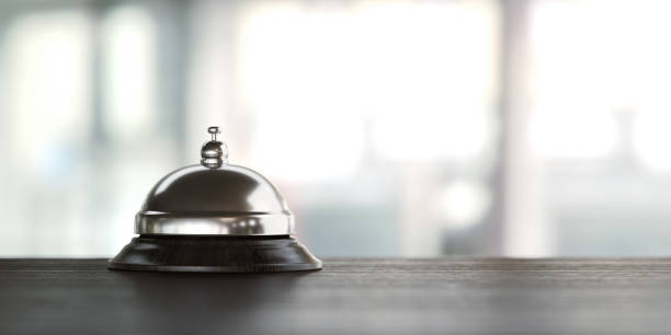 istock Concierge Bell On Wood Desk Over Defocused Background 930158136
