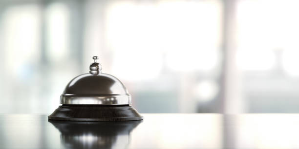 Concierge Bell Over Defocused Background Concierge bell over defocused background Horizontal composition with copy space. bellhop photos stock pictures, royalty-free photos & images