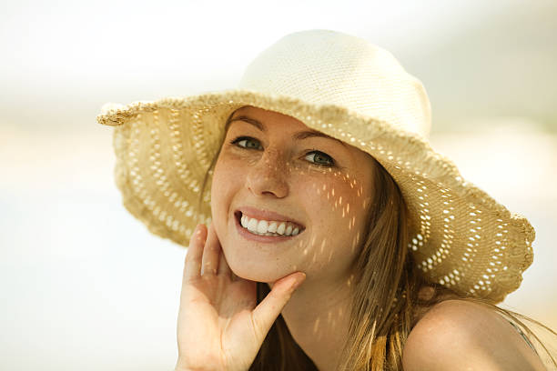 istock Beautiful young woman smiling on the beach 93016198