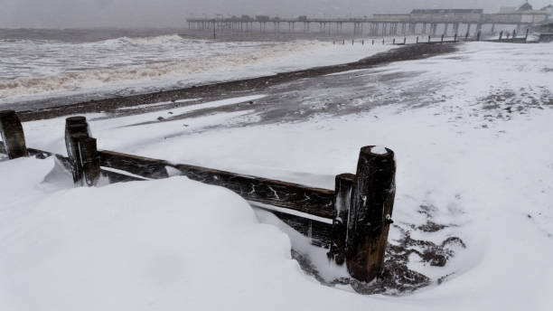 istock Teignmouth beach Devon UK during snow Storm Emma 930165974