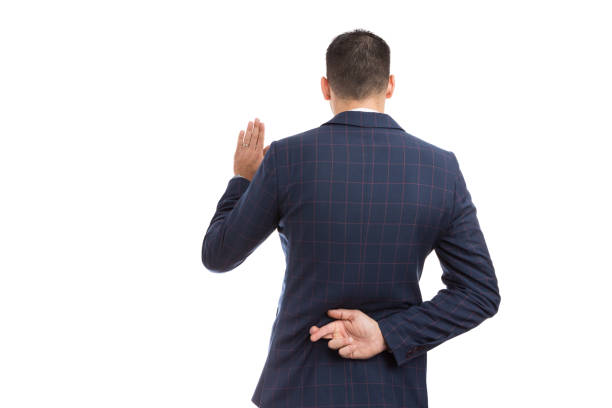 istock Fake oath vow gesture with fingers crossed behind back 930172140