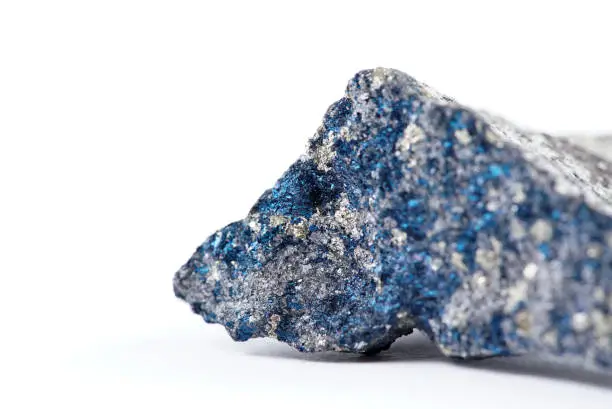 Sample of blue chalcopyrite mineral isolated on white.