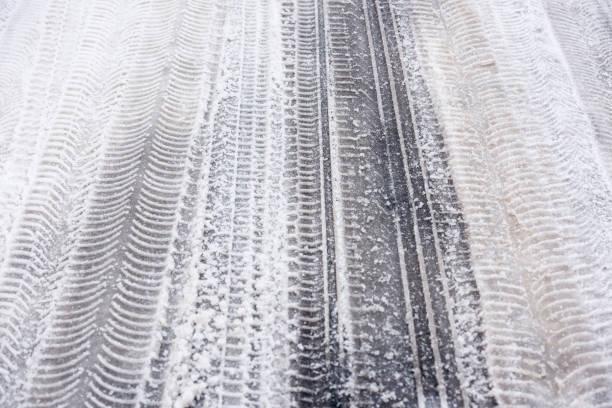istock Traces of car tires on the snow 930186270