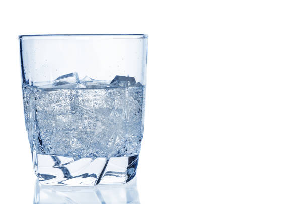 istock Sparkling soda  with ice in glass on white background 930193060