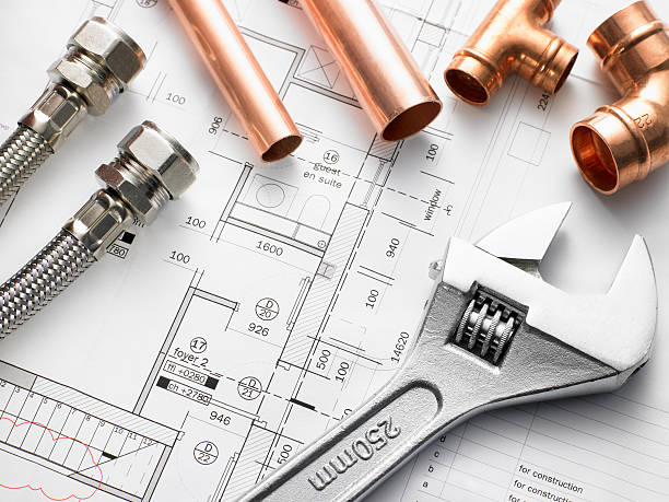 Closeup shot of plumbing equipment on house plans  water pipe stock pictures, royalty-free photos & images