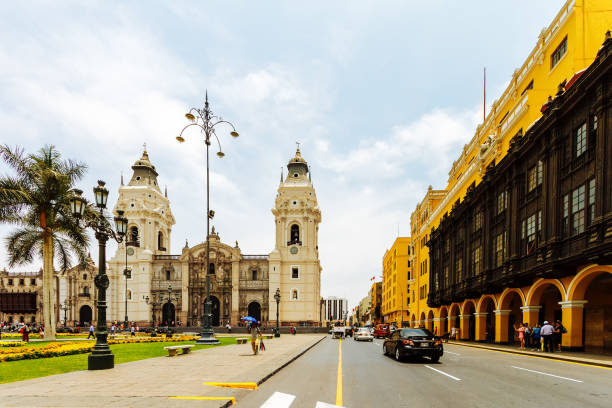 Daily image of the Plaza Mayor in Lima (Peru) with the cathedral in the background and typical buildings with tourists Lima, Peru - February 2, 2018: Daily image of the Plaza Mayor in Lima (Peru) with the cathedral in the background and typical buildings with tourists peru city stock pictures, royalty-free photos & images