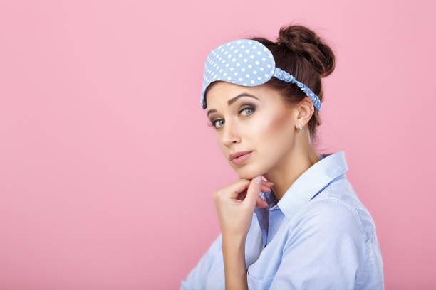 istock woman in pajamas and mask for sleeping 930217676