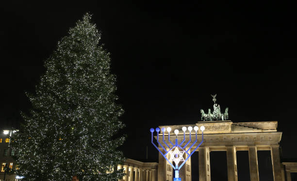istock Menorah and Christmas Tree in Pariser Platz, Berlin, Germany 930217898