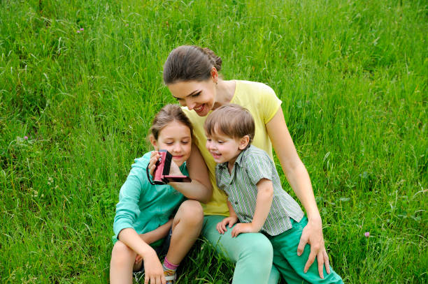 istock Mother and children with Video Camera. 930227256