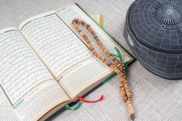 istock High Angle View Of Koran With Religious Beads And Cap On Table 930253970