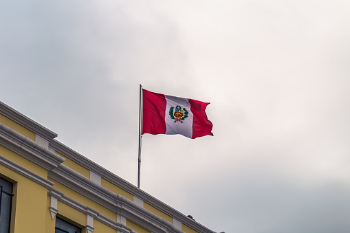 Lima, Peru - August 16, 2017: Flag of Peru in the historic center of the city of Lima, Peru