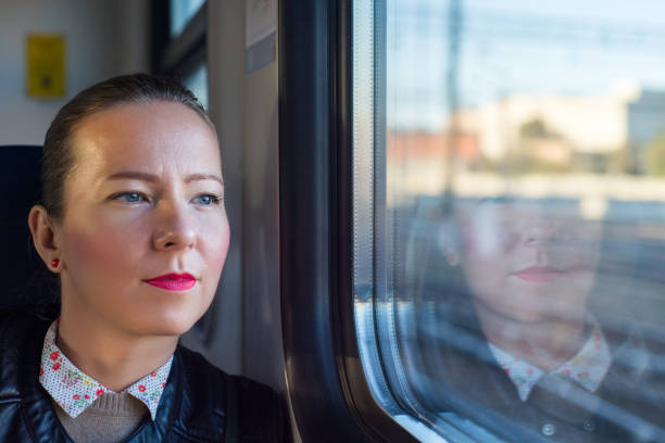 istock Young woman traveling by train 930265144