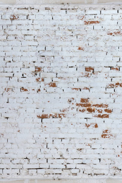 istock Brick wall whitewashed by lime, dirty and rubbed, traces of brush 930265360