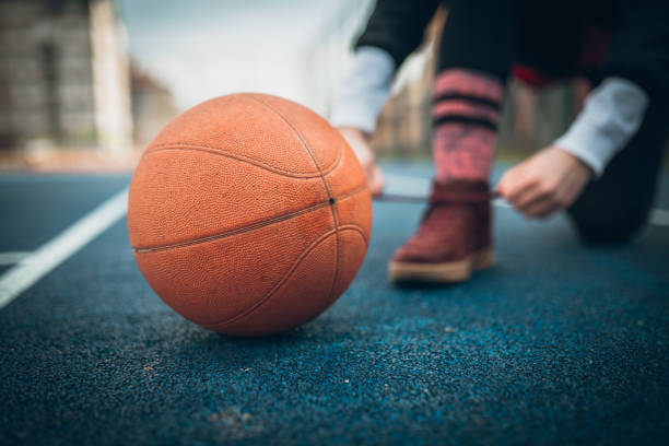 istock Woman at basketball playground 930267614