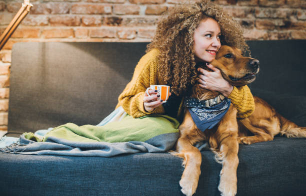 Woman playing with her dogs