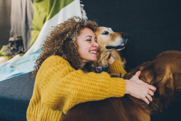 istock Woman playing with her dogs 930268014