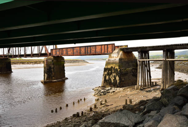 istock Old Abandoned Railroad Bridge View from Underneath the New Modern Bridge Annapolis Royal Nova Scotia Canada 930268416