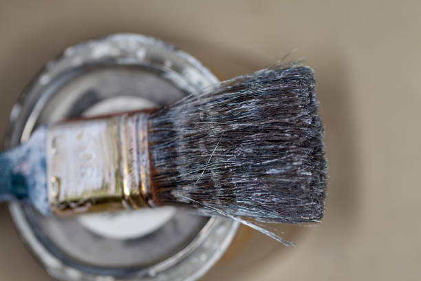 istock a paint brush lies on a paint pot 930268432
