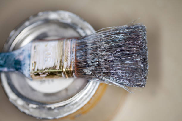 istock a paint brush lies on a paint pot 930268442