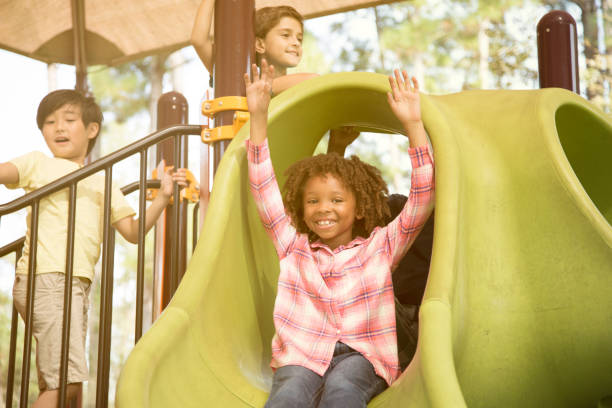istock Multi-ethnic group of school children playing on school playground. 930273668