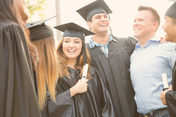 istock College students and friends after graduation ceremony. 930277988