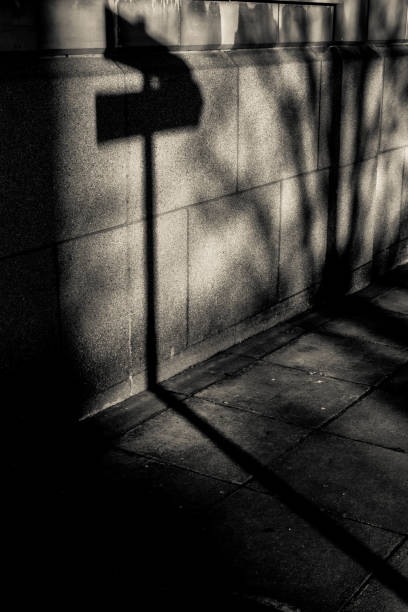 istock Shadow of two directional street signs 930278784