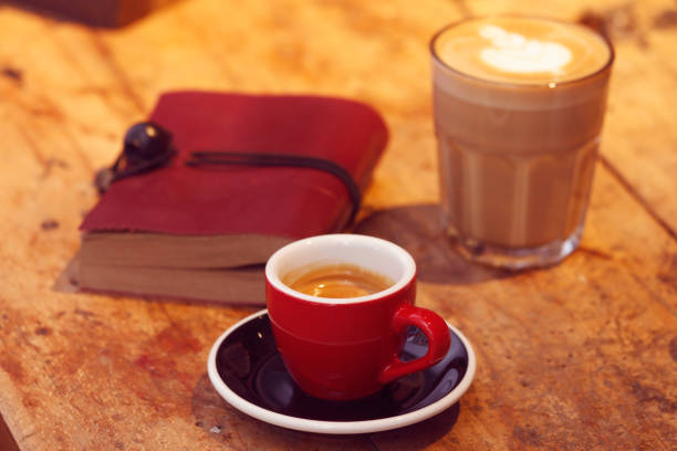 istock Close-Up Of Coffee and Notebook On Table 930287168