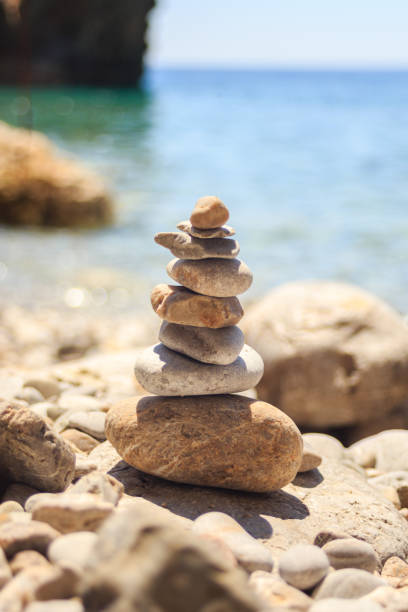 istock stone tower made of pebbles on the beach 930290658
