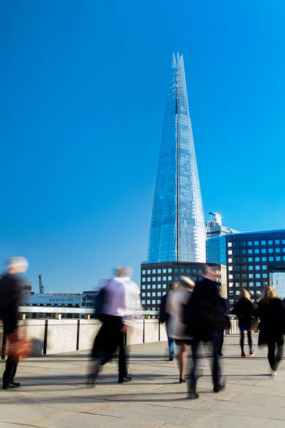 istock Commuters walking across London Bridge to Underground Station, UK 930304402
