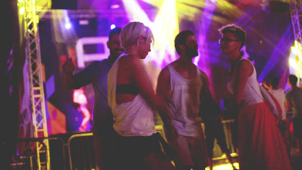 istock Four people dancing on festival 930309068