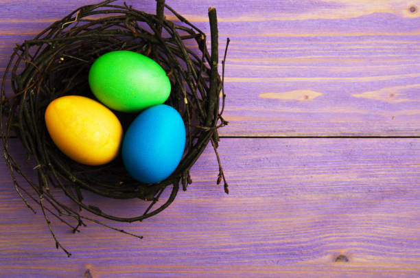 istock Easter eggs on a wooden background .Easter eggs of different colors .Easter eggs top view 930309094