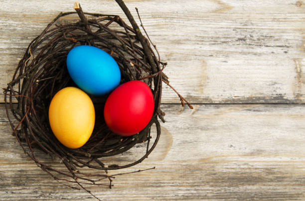 istock Easter eggs on a wooden background .Easter eggs of different colors .Easter eggs top view 930309100