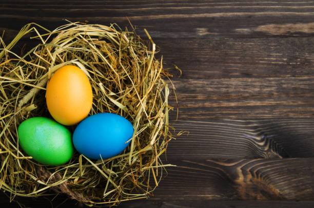 istock Easter eggs on a wooden background .Easter eggs of different colors .Easter eggs top view 930309106