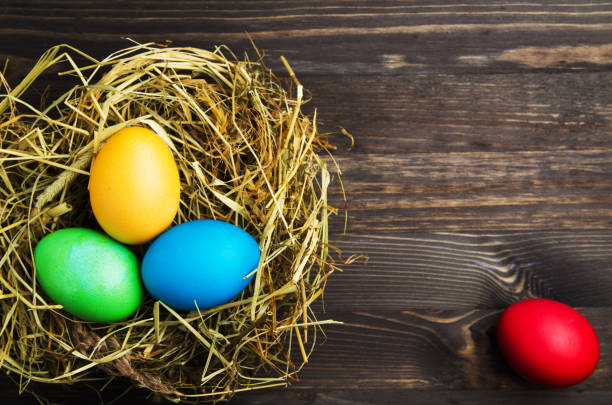 istock Easter eggs on a wooden background .Easter eggs of different colors .Easter eggs top view 930309108
