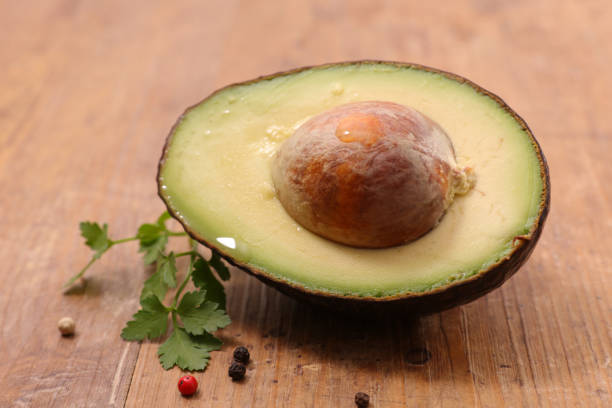 istock fresh avocado on wood background 930312550